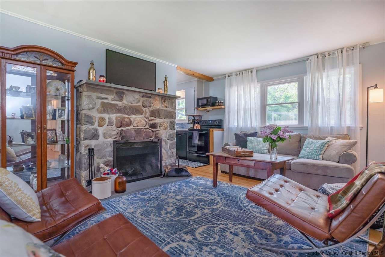 84 Benner Road Red Hook, NY 12571 - Photo 5 of 33 a living room with furniture and a fireplace