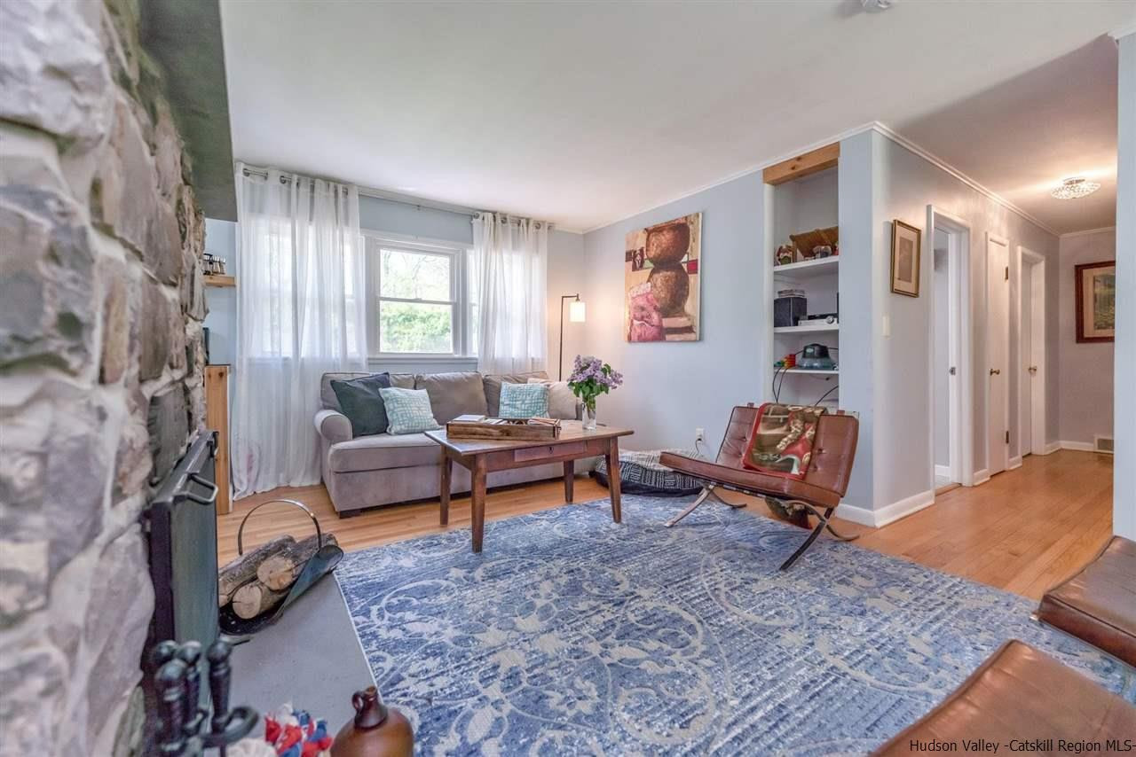 84 Benner Road Red Hook, NY 12571 - Photo 8 of 33 a living room with furniture a rug and a window