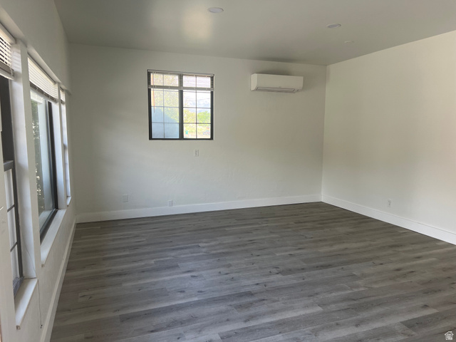 875 Cedar Hollow Road Lehi, UT 84043 - Photo 16 of 76 Contemporary interior featuring wood-finish flooring, white walls, recessed ceiling lights, and multiple windows