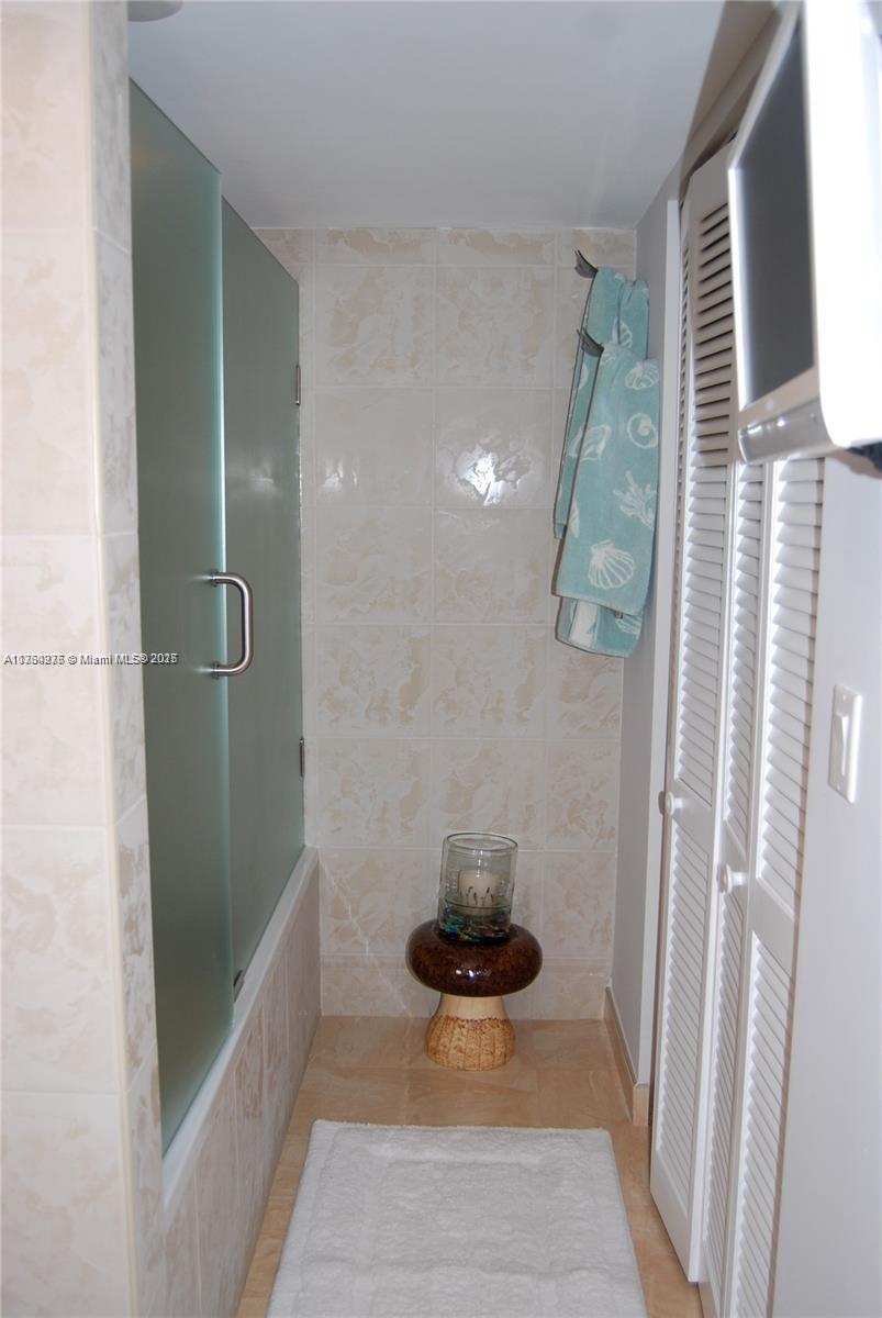 6423 Collins Avenue, Unit 901 Miami Beach, FL 33141 - Photo 17 of 17 a bathroom with a shower and toilet
