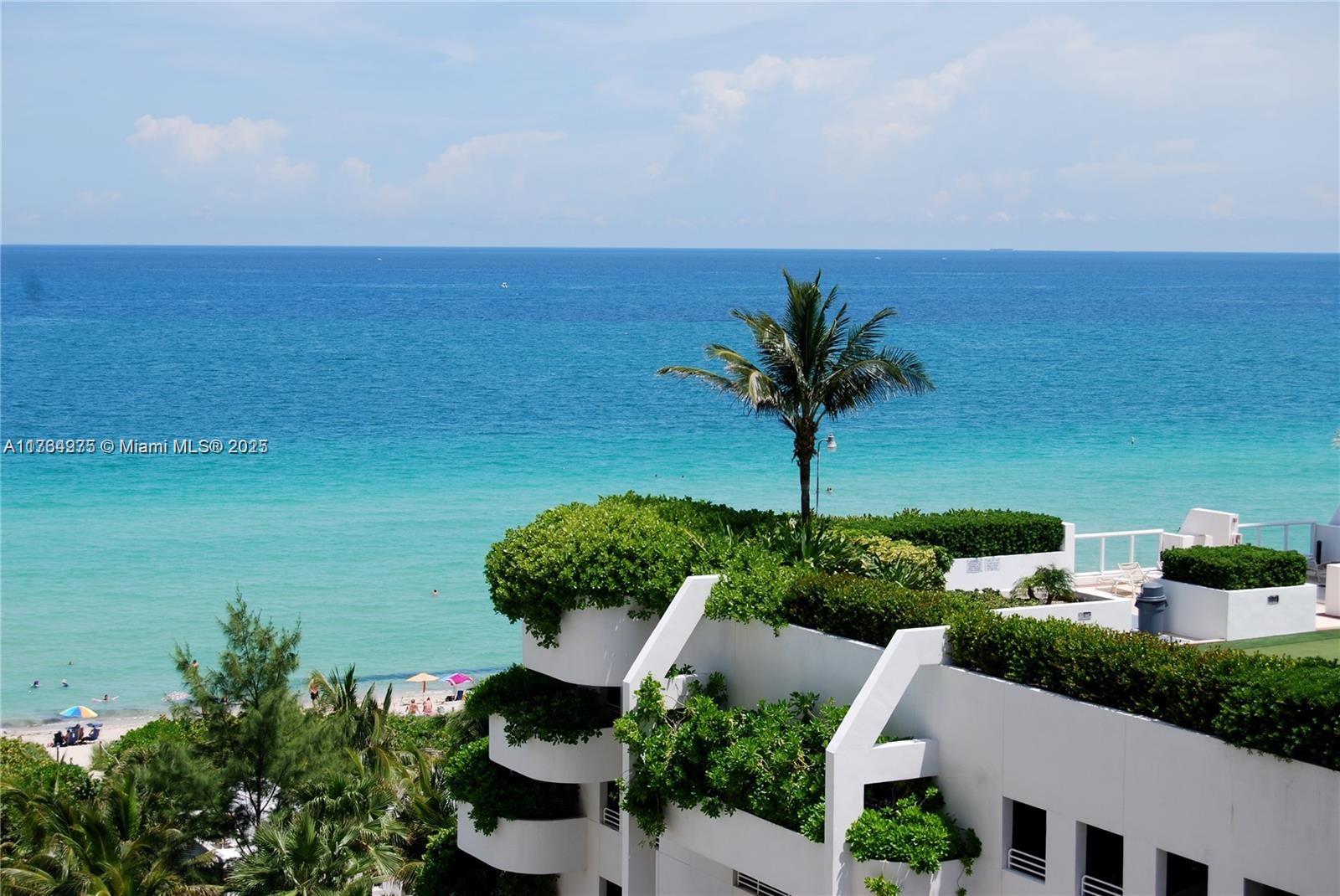 6423 Collins Avenue, Unit 901 Miami Beach, FL 33141 - Photo 3 of 17 a view of a lake with a garden