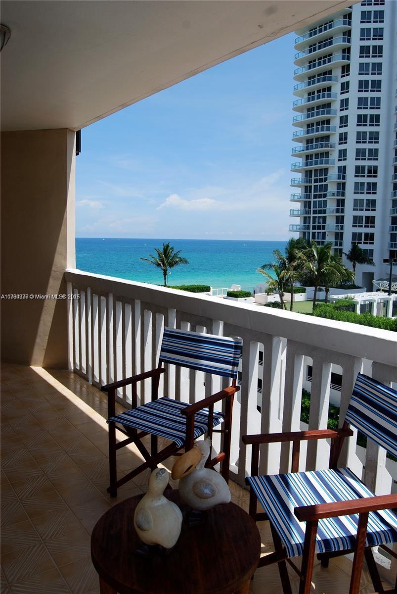6423 Collins Avenue, Unit 901 Miami Beach, FL 33141 - Photo 5 of 17 a view of a balcony with chairs