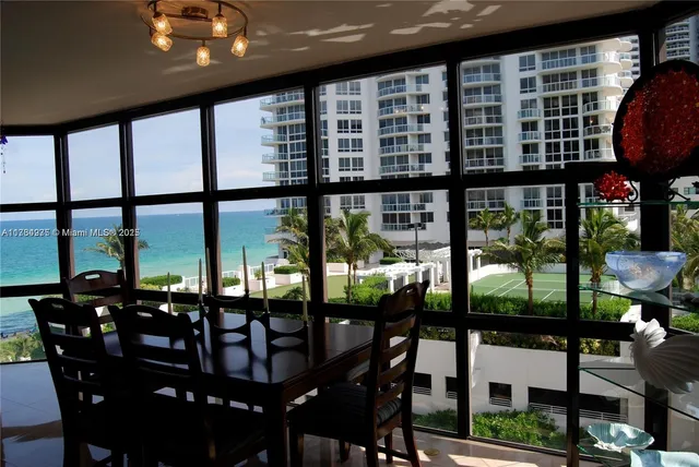 a view of a dining room with furniture window and outside view