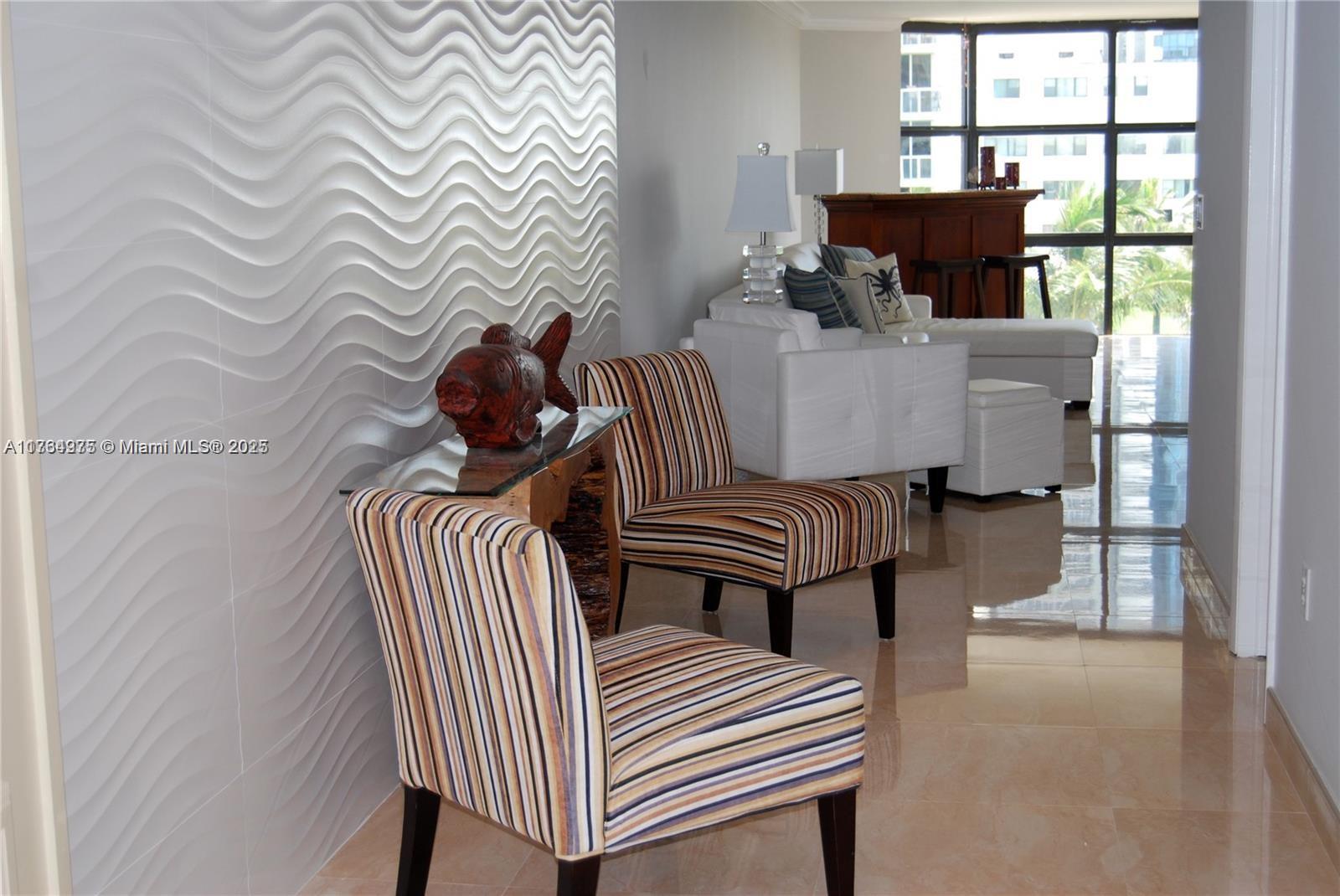 6423 Collins Avenue, Unit 901 Miami Beach, FL 33141 - Photo 10 of 17 a bedroom with furniture and a window