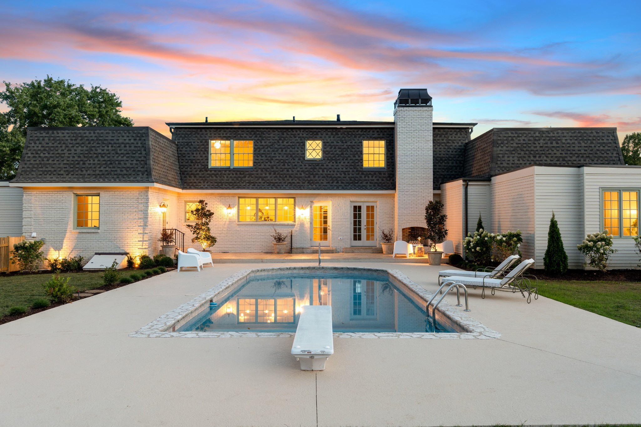 a view of a swimming pool with outdoor seating