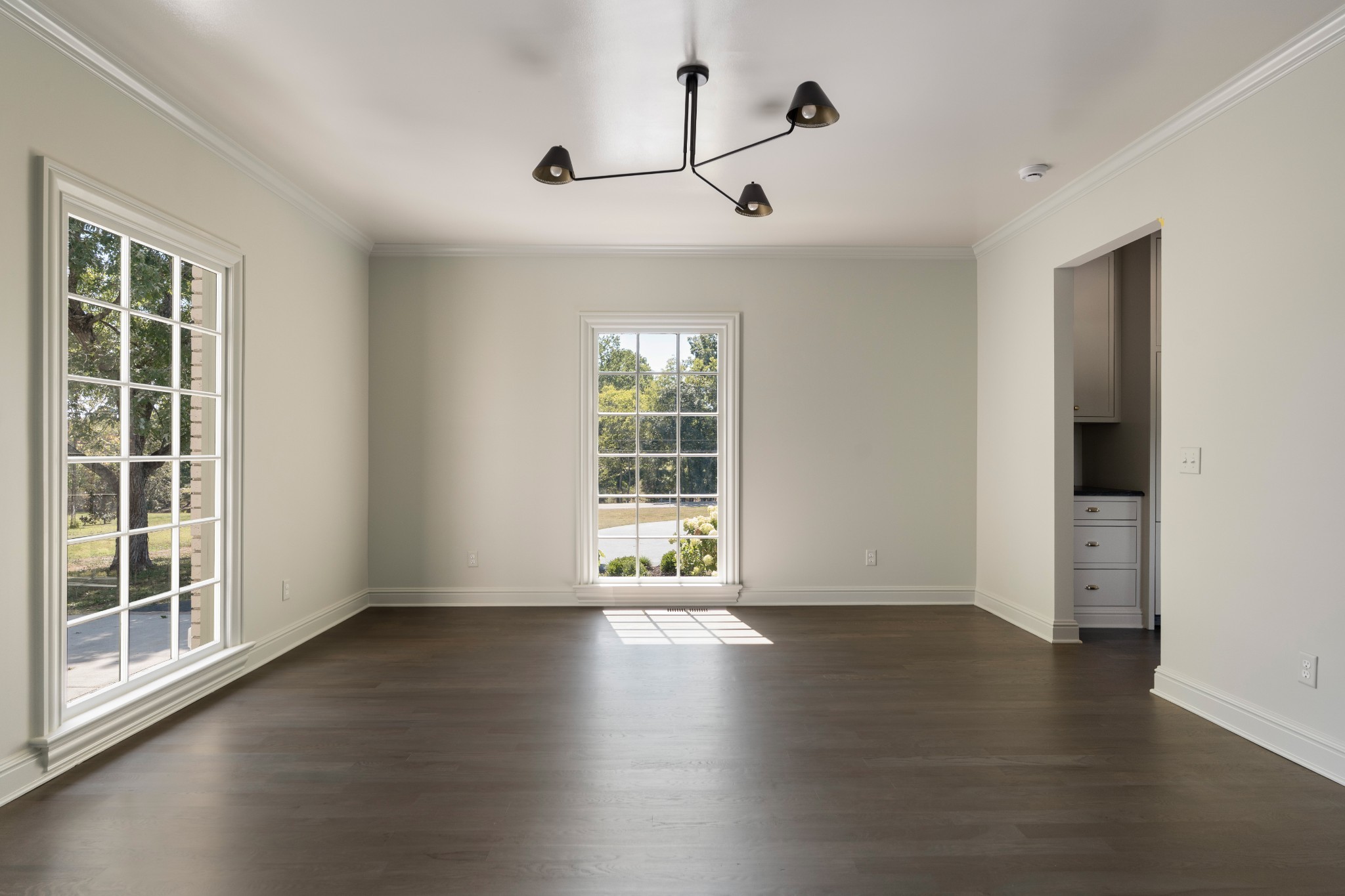 896 Sneed Road West Franklin, TN 37069 - Photo 25 of 55 a view of an empty room with wooden floor and a window