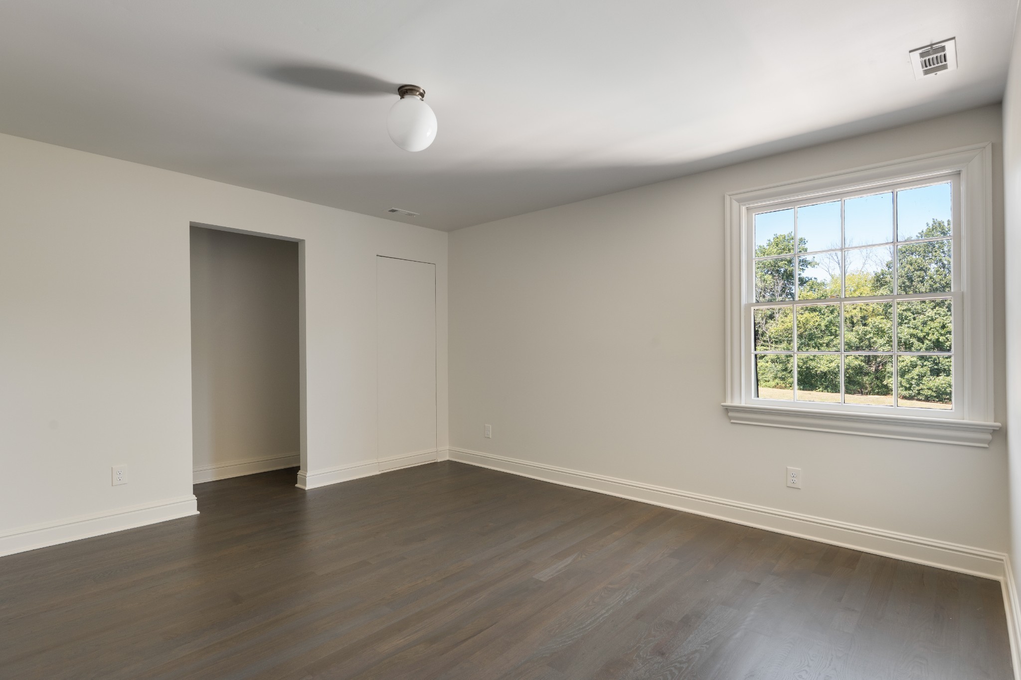 896 Sneed Road West Franklin, TN 37069 - Photo 41 of 55 an empty room with wooden floor and windows