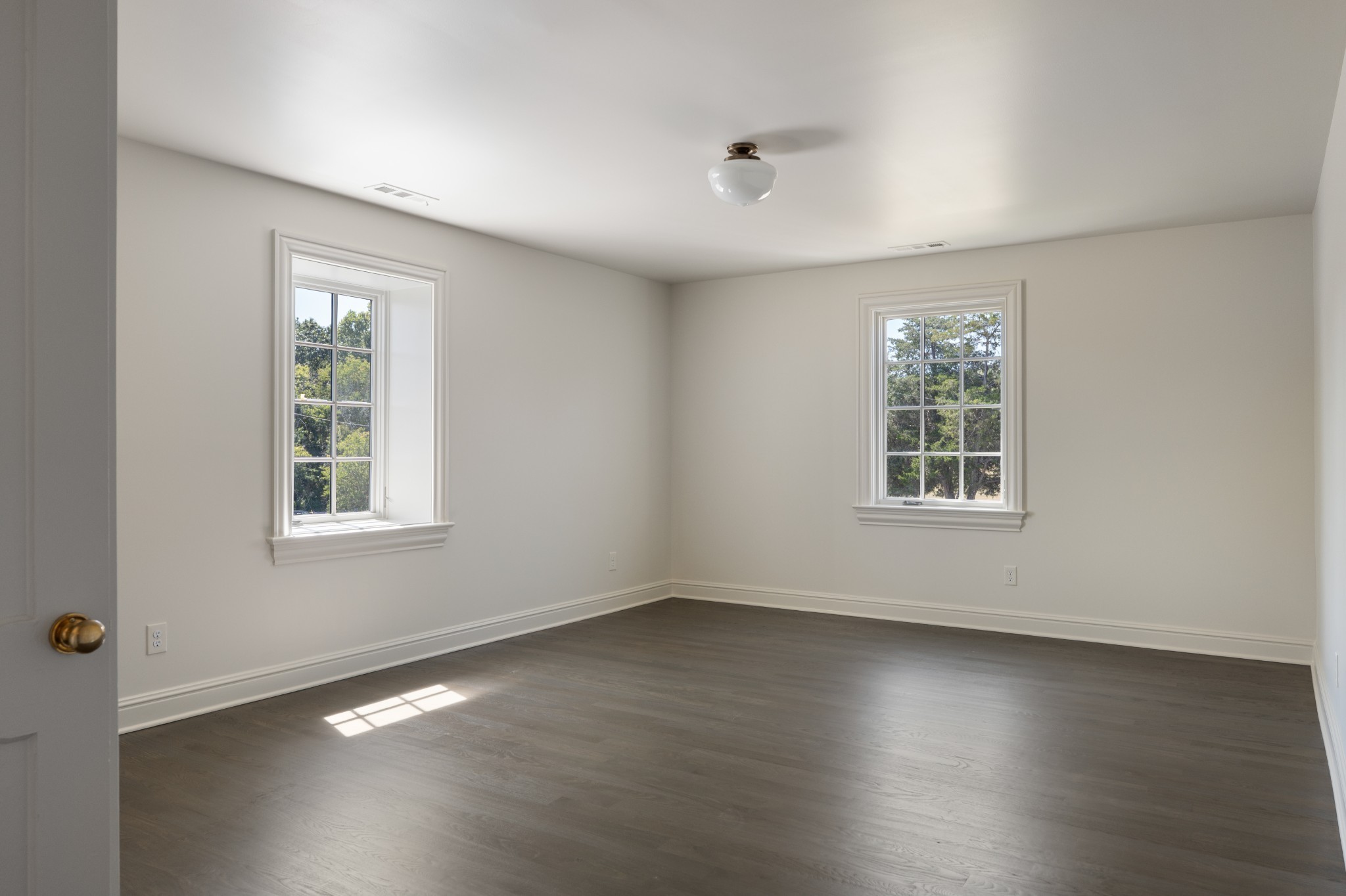 896 Sneed Road West Franklin, TN 37069 - Photo 43 of 55 an empty room with wooden floor and windows