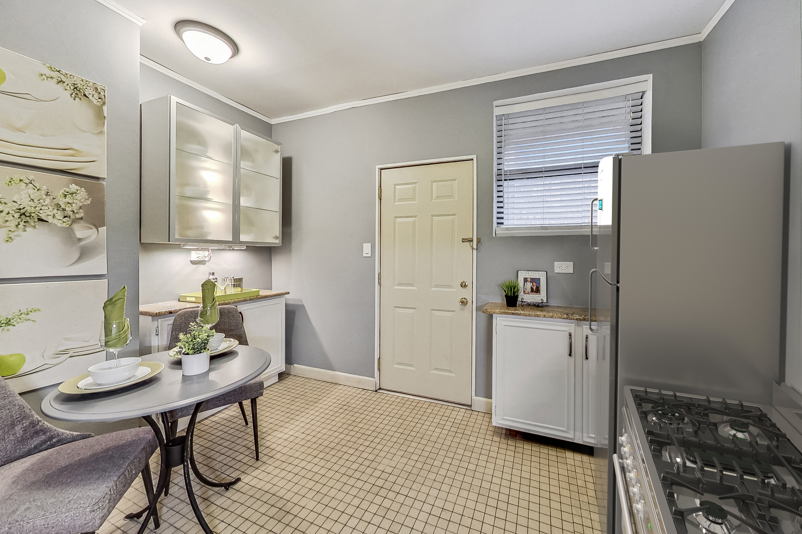 545 West Brompton Avenue, Unit 2S Chicago, IL 60657 - Photo 12 of 29 a kitchen with a sink a stove a refrigerator and cabinets