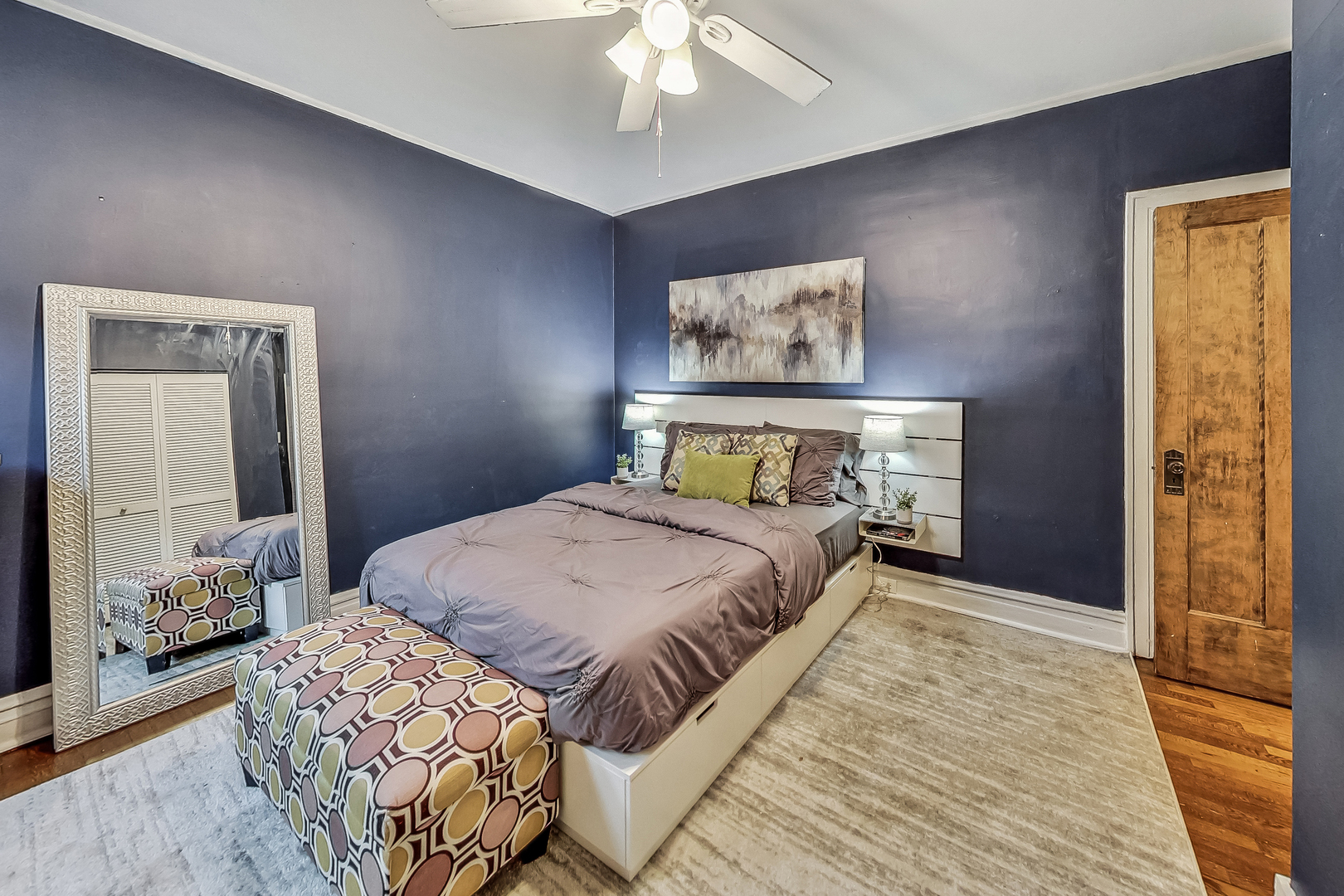 545 West Brompton Avenue, Unit 2S Chicago, IL 60657 - Photo 15 of 29 a bedroom with a bed and a chandelier