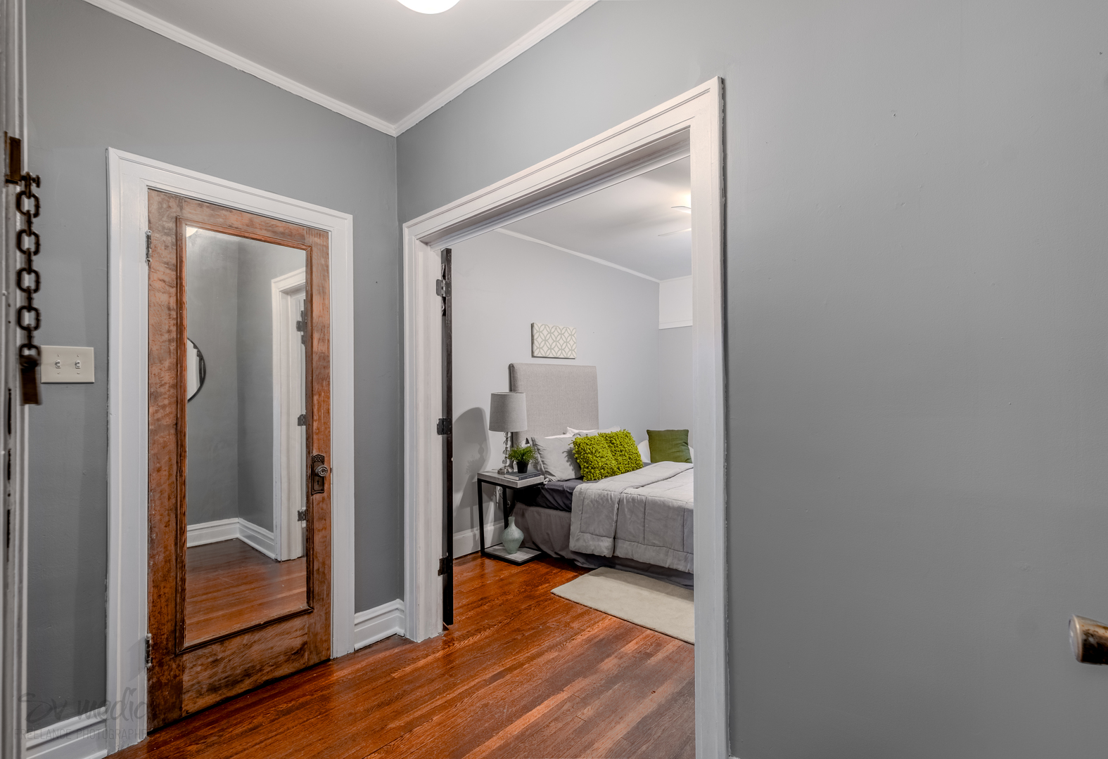 545 West Brompton Avenue, Unit 2S Chicago, IL 60657 - Photo 18 of 29 a bedroom with a bed and wooden floor