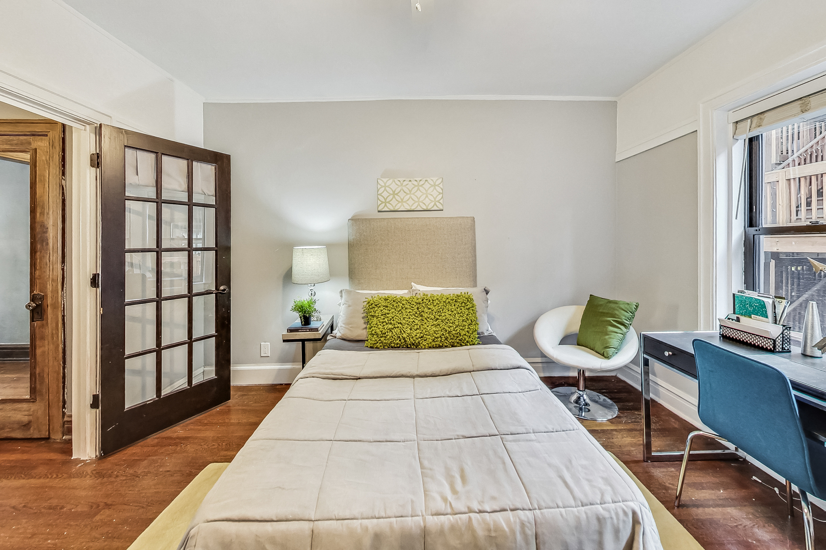 545 West Brompton Avenue, Unit 2S Chicago, IL 60657 - Photo 20 of 29 a bedroom with a bed a dresser and windows