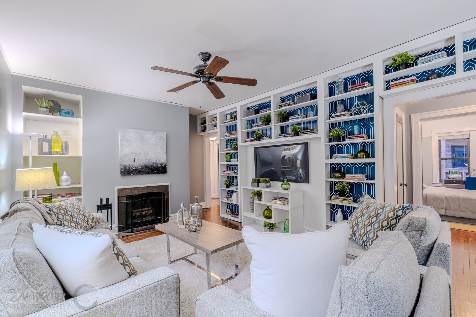 545 West Brompton Avenue, Unit 2S Chicago, IL 60657 - Photo 9 of 29 a living room with furniture a flat screen tv and a fireplace