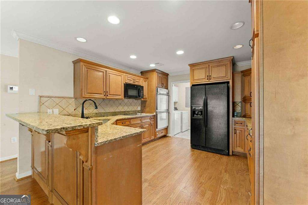 749 Hubert Pittman Road, Unit TRACT 2 Pendergrass, GA 30567 - Photo 13 of 61 a kitchen with stainless steel appliances granite countertop a refrigerator and a sink