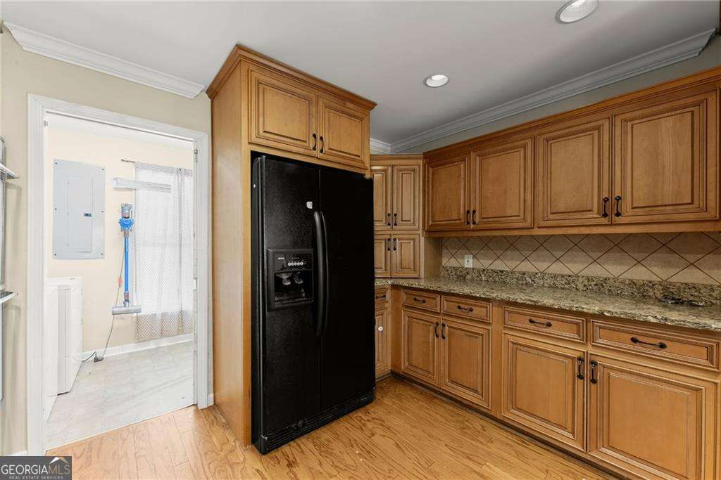 749 Hubert Pittman Road, Unit TRACT 2 Pendergrass, GA 30567 - Photo 15 of 61 a kitchen with granite countertop a refrigerator and a sink
