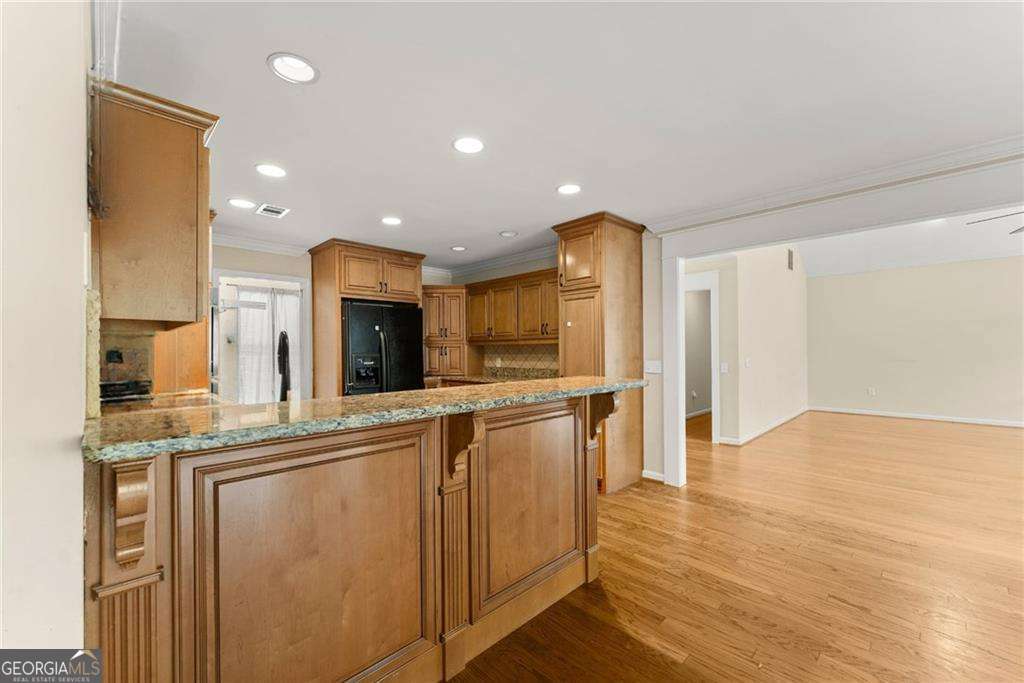 749 Hubert Pittman Road, Unit TRACT 2 Pendergrass, GA 30567 - Photo 16 of 61 a kitchen with stainless steel appliances granite countertop a refrigerator and a stove top oven