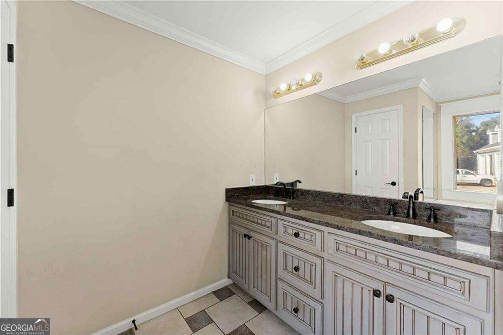 749 Hubert Pittman Road, Unit TRACT 2 Pendergrass, GA 30567 - Photo 21 of 61 a bathroom with a granite countertop sink and a mirror