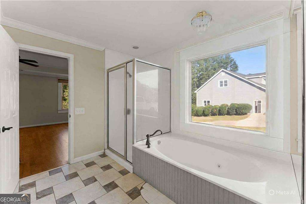 749 Hubert Pittman Road, Unit TRACT 2 Pendergrass, GA 30567 - Photo 23 of 61 a bathroom with a bathtub and a shower