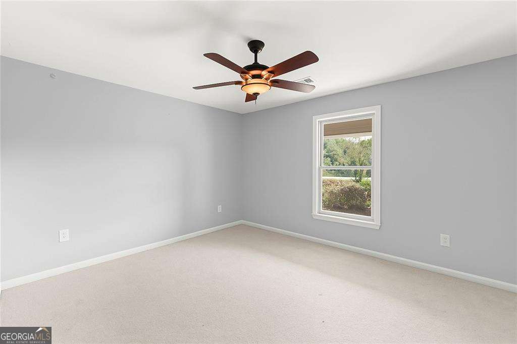 749 Hubert Pittman Road, Unit TRACT 2 Pendergrass, GA 30567 - Photo 27 of 61 an empty room with windows and fan