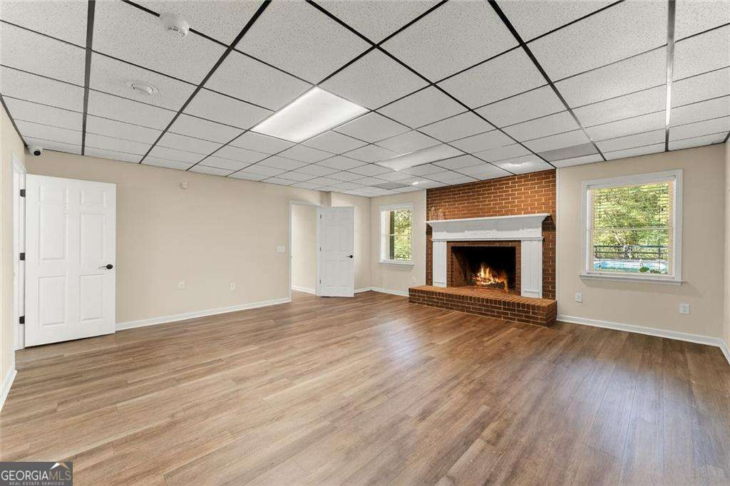 749 Hubert Pittman Road, Unit TRACT 2 Pendergrass, GA 30567 - Photo 30 of 61 a view of empty room with wooden floor and fireplace