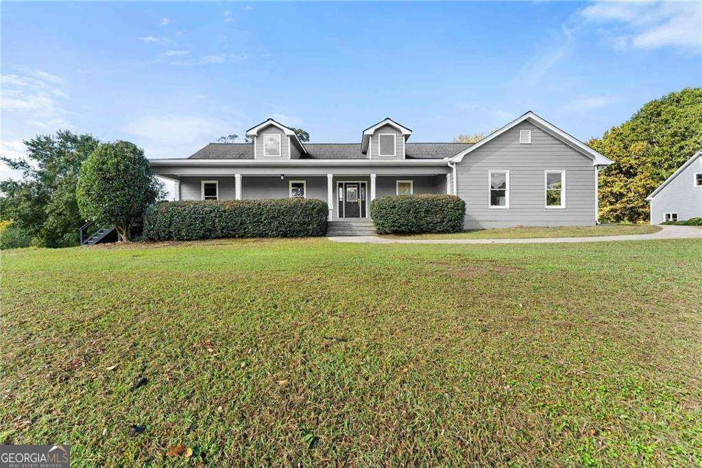 749 Hubert Pittman Road, Unit TRACT 2 Pendergrass, GA 30567 - Photo 3 of 61 a front view of a house with yard and green space