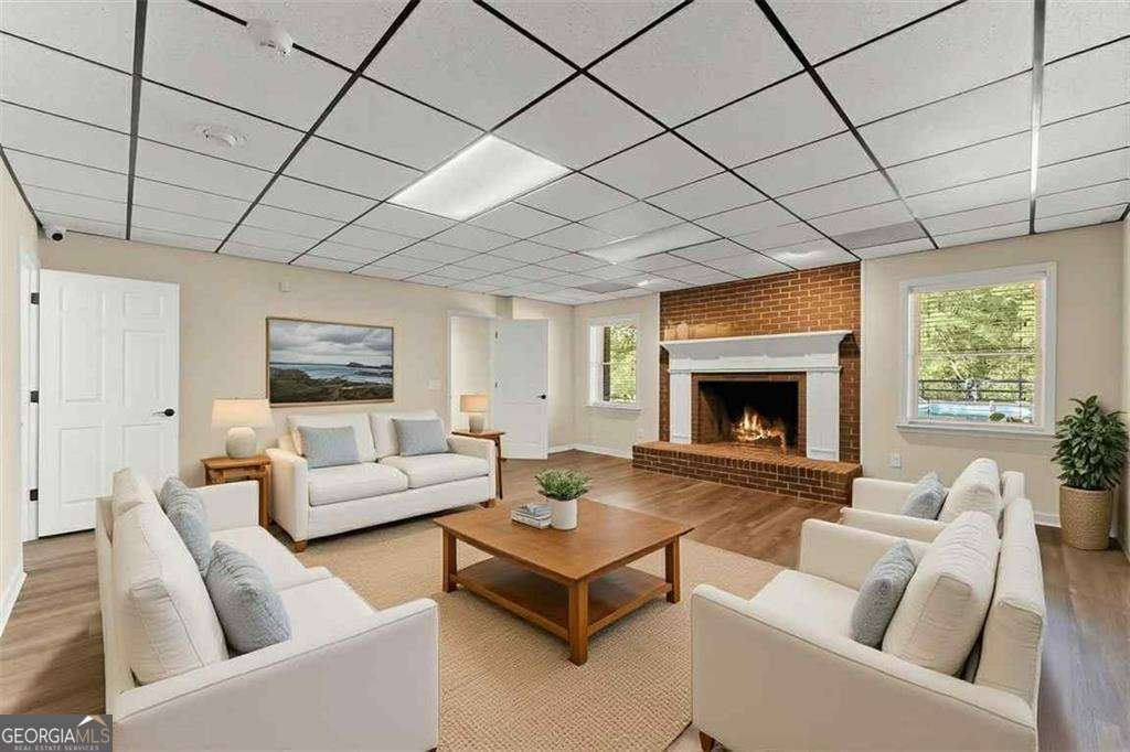 749 Hubert Pittman Road, Unit TRACT 2 Pendergrass, GA 30567 - Photo 33 of 61 a living room with furniture and a fireplace