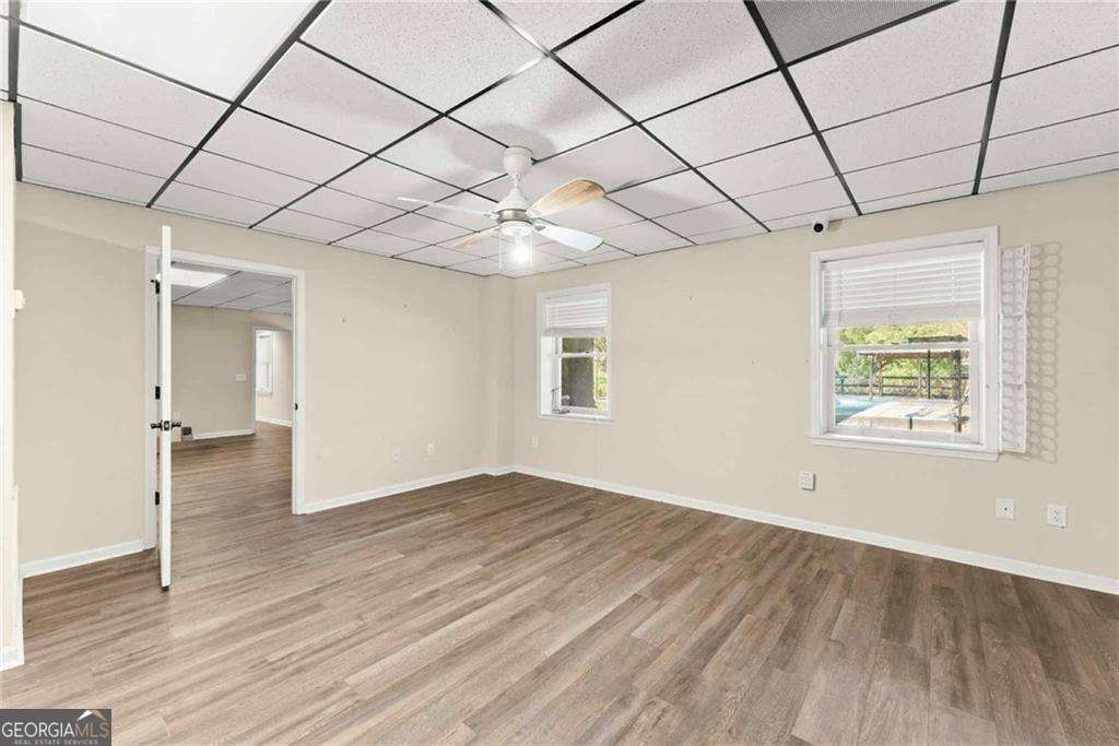 749 Hubert Pittman Road, Unit TRACT 2 Pendergrass, GA 30567 - Photo 38 of 61 an empty room with wooden floor and windows