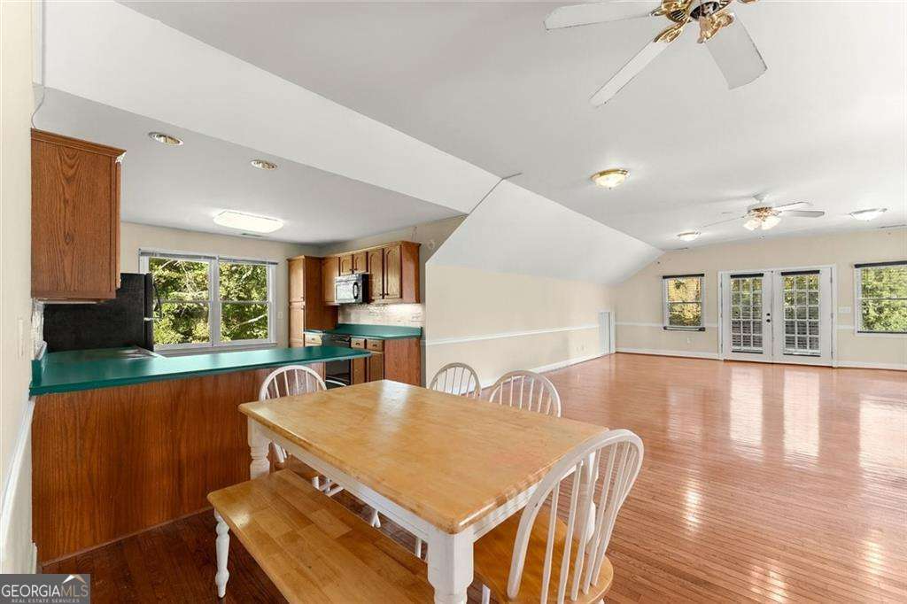 749 Hubert Pittman Road, Unit TRACT 2 Pendergrass, GA 30567 - Photo 45 of 61 a view of a dining room with furniture window and wooden floor