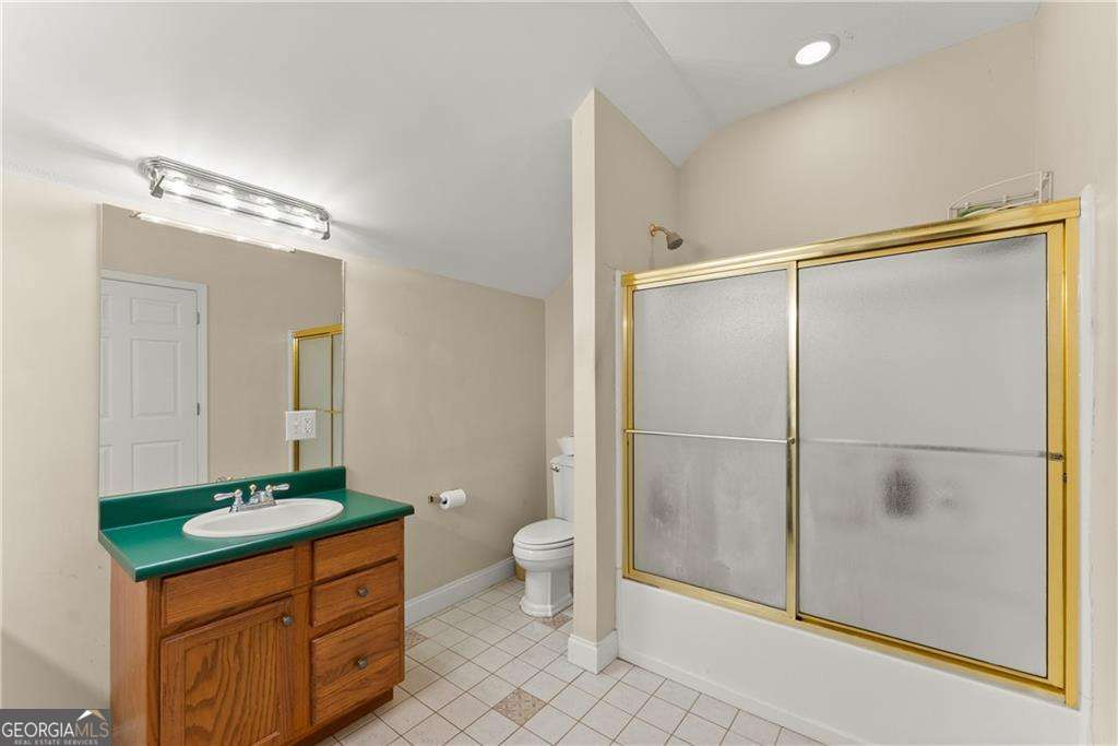 749 Hubert Pittman Road, Unit TRACT 2 Pendergrass, GA 30567 - Photo 52 of 61 a bathroom with a sink a toilet and shower