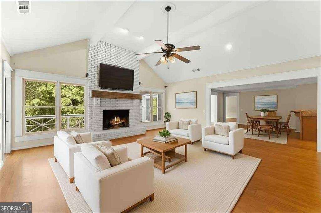 749 Hubert Pittman Road, Unit TRACT 2 Pendergrass, GA 30567 - Photo 7 of 61 a living room with furniture fireplace and a flat screen tv