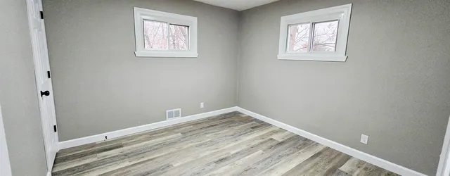 an empty room with windows