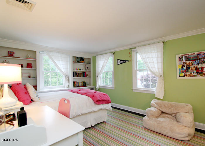 21 Pierce Road Riverside, CT 06878 - Photo 12 of 16 a bedroom with a bed and a large window