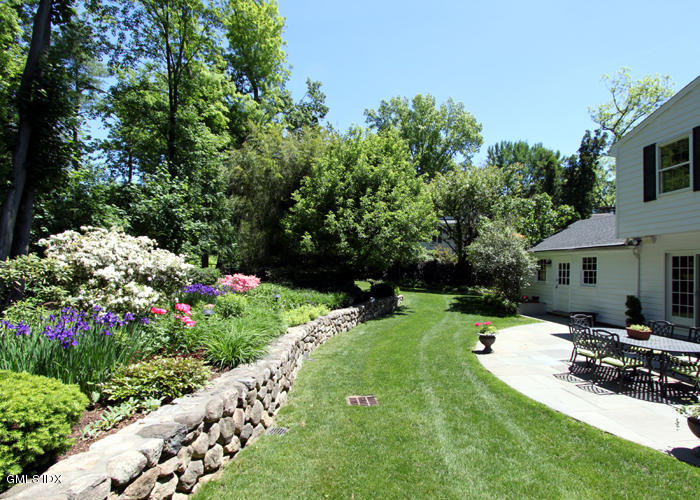 21 Pierce Road Riverside, CT 06878 - Photo 16 of 16 a view of a house with a backyard and garden
