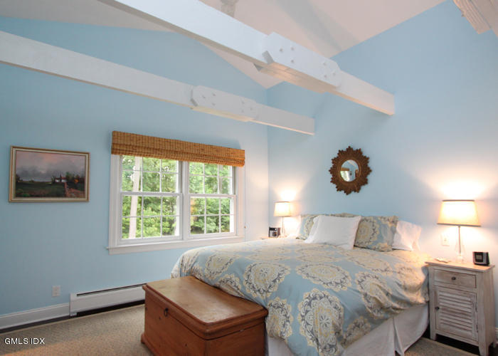 21 Pierce Road Riverside, CT 06878 - Photo 9 of 16 a bedroom with a bed and window