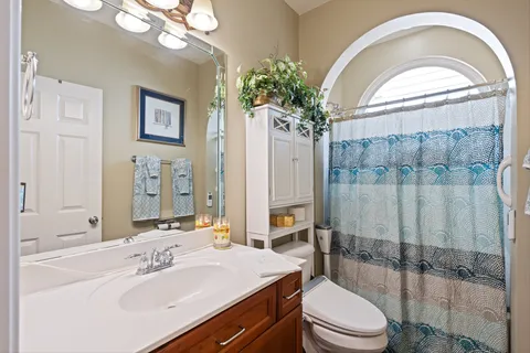 a kitchen with kitchen island granite countertop a stove and a sink