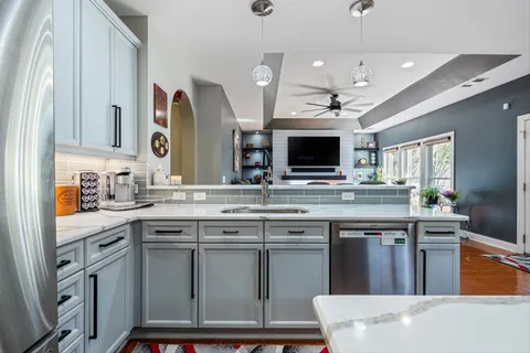 a bedroom with bed and wooden floor