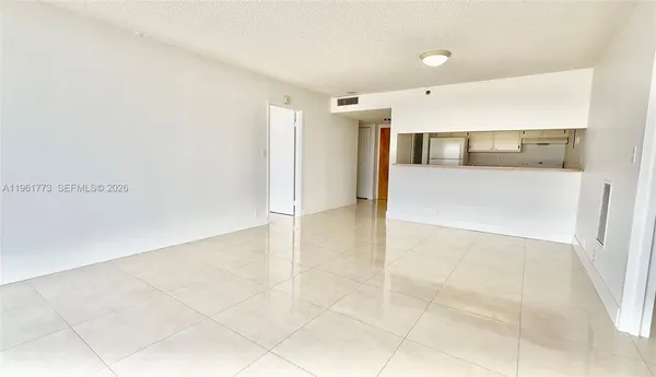 a view of an empty room and window