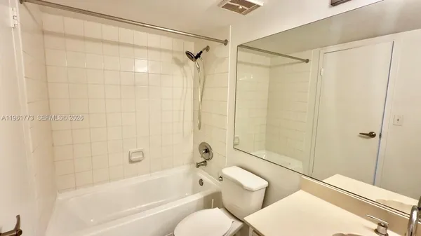 a view of empty room with floor to ceiling window