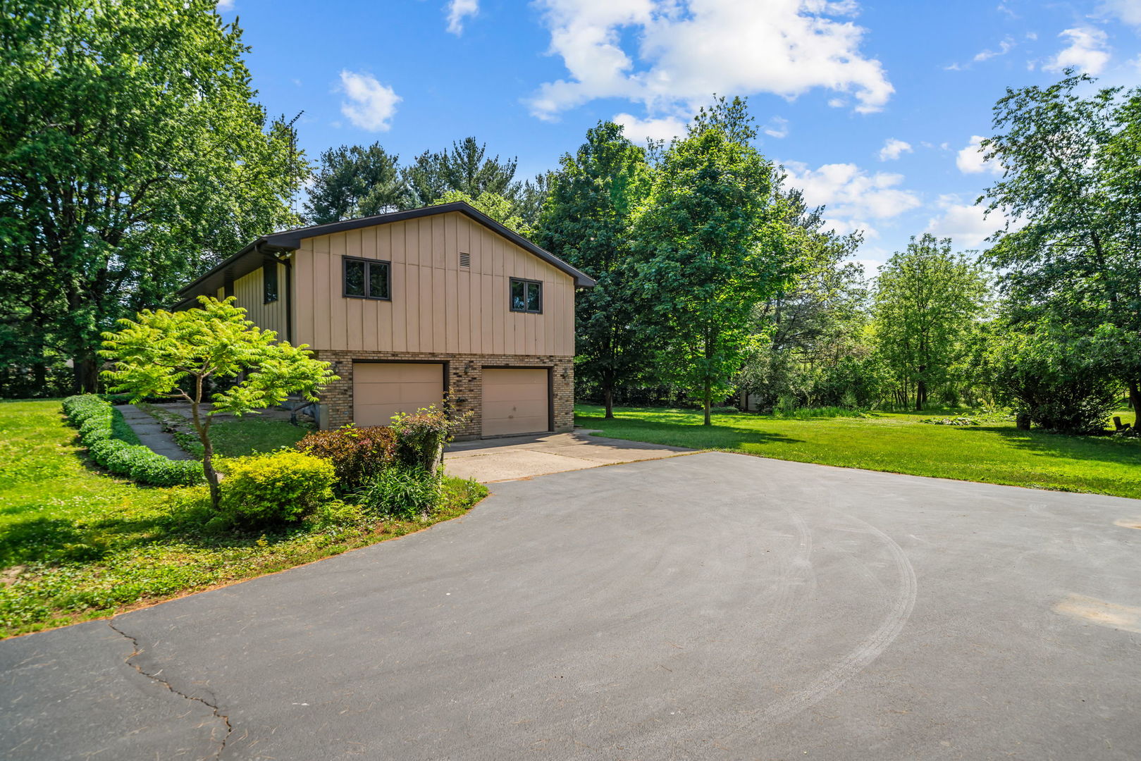 5748 South Skare Road Rochelle, IL 61068 - Photo 39 of 45 a view of a house with a yard and potted plants