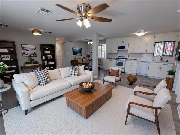 a living room with furniture and a chandelier