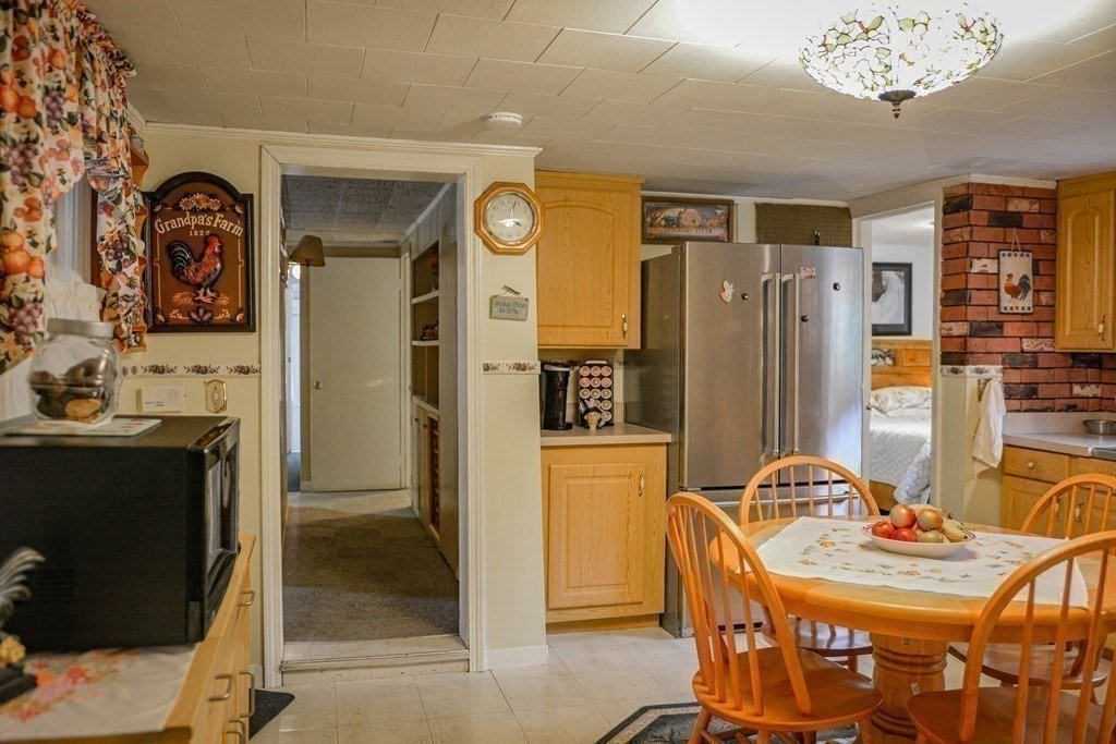 345 Richardson Road Ashby, MA 01431 - Photo 14 of 37 a dining room with furniture and chandelier