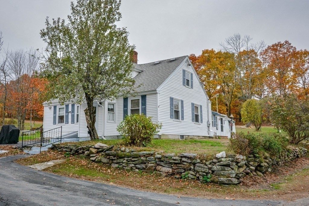 345 Richardson Road Ashby, MA 01431 - Photo 2 of 37 front view of a house with a yard