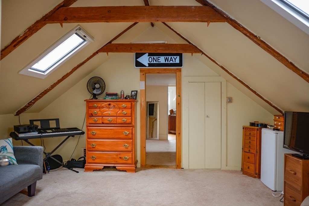 345 Richardson Road Ashby, MA 01431 - Photo 23 of 37 a view of walk in closet with clothes and shoes