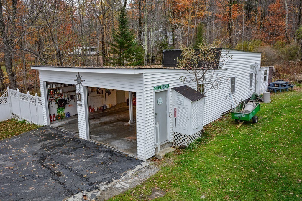 345 Richardson Road Ashby, MA 01431 - Photo 6 of 37 a front view of a house with garden