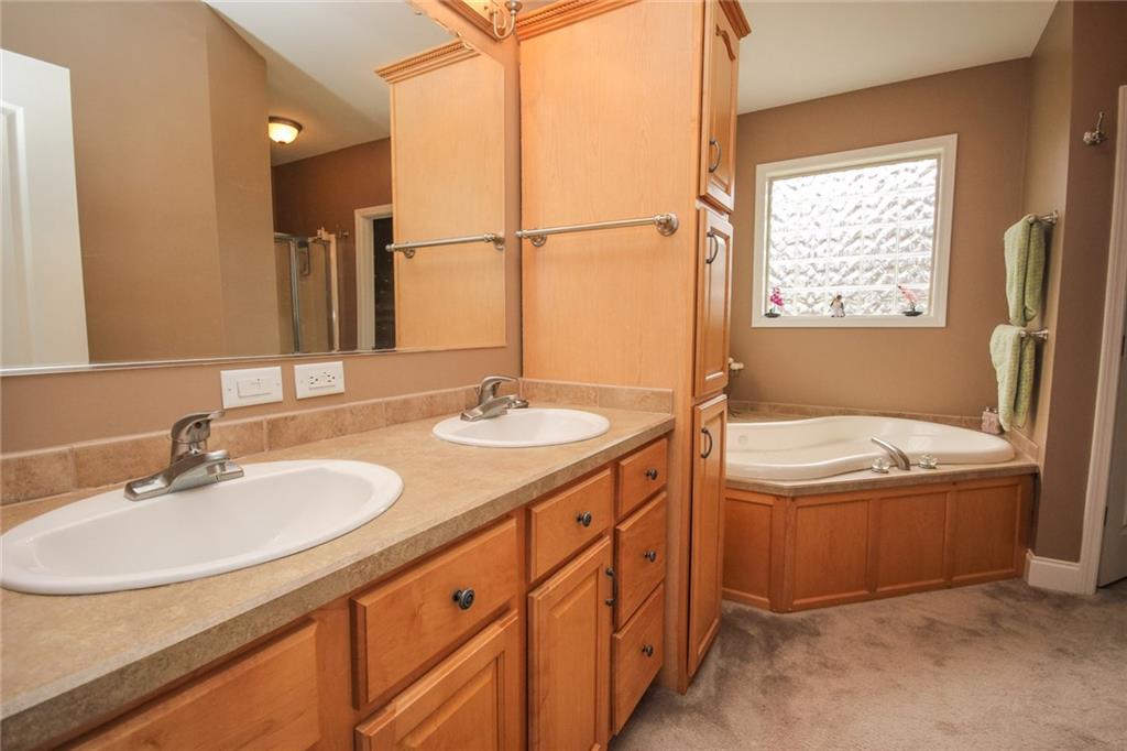 393 Mowry Road Monaca, PA 15061 - Photo 14 of 25 Double vanity, jetted tub, large walk-in closet and stand up shower.