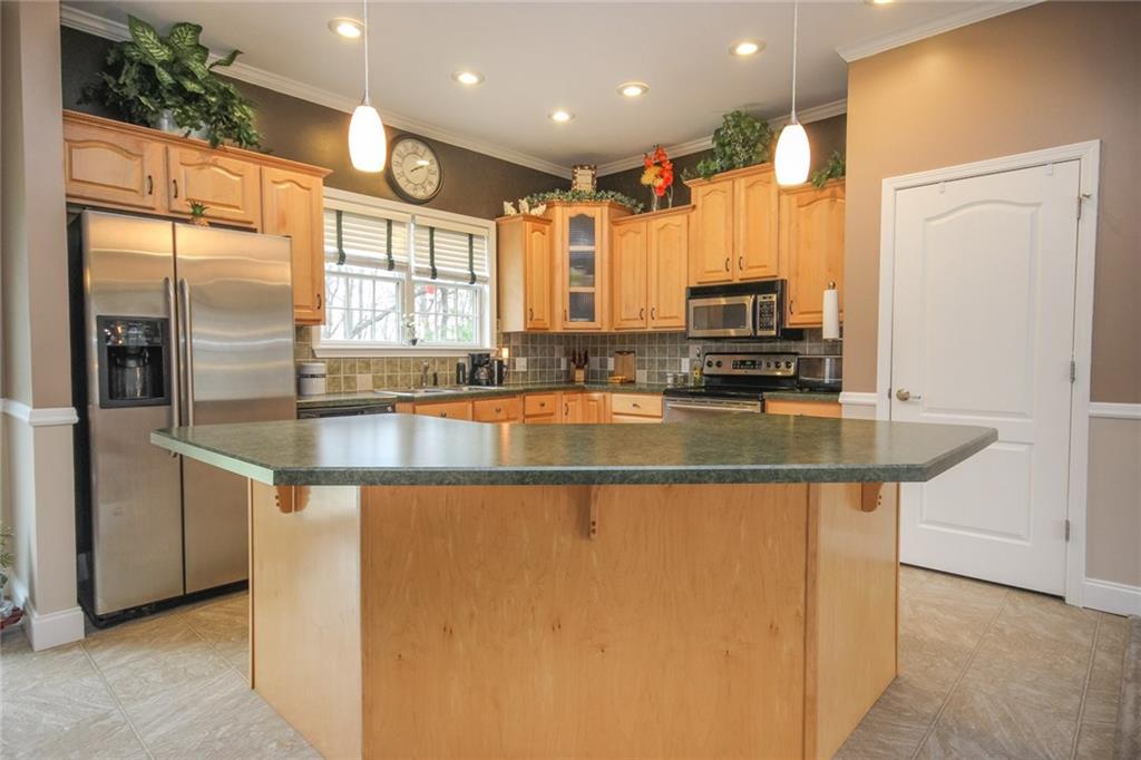 393 Mowry Road Monaca, PA 15061 - Photo 5 of 25 Breakfast bar for four! Plenty of space and open to the dining room and living room. Great for entertaining.
