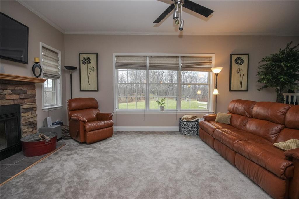 393 Mowry Road Monaca, PA 15061 - Photo 8 of 25 Large living room, stone, wood burning fireplace, large windows and lots of lot!