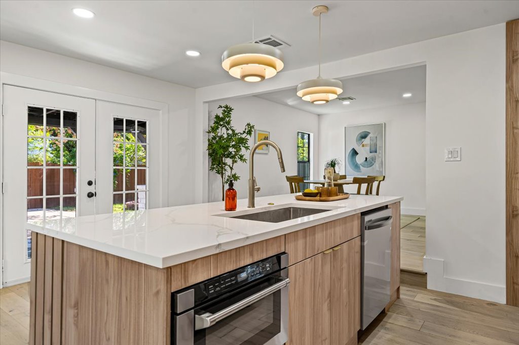 2014 Hardy Circle Austin, TX 78757 - Photo 13 of 34 a kitchen with a sink a counter space and wooden floor