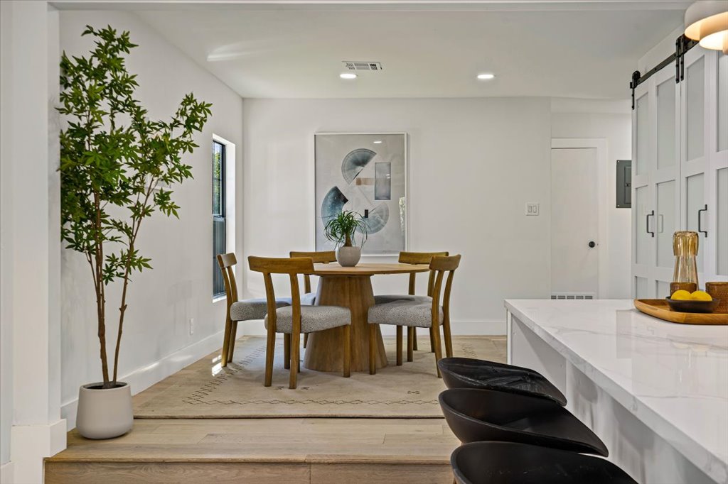 2014 Hardy Circle Austin, TX 78757 - Photo 15 of 34 a dining room with furniture and a potted plant