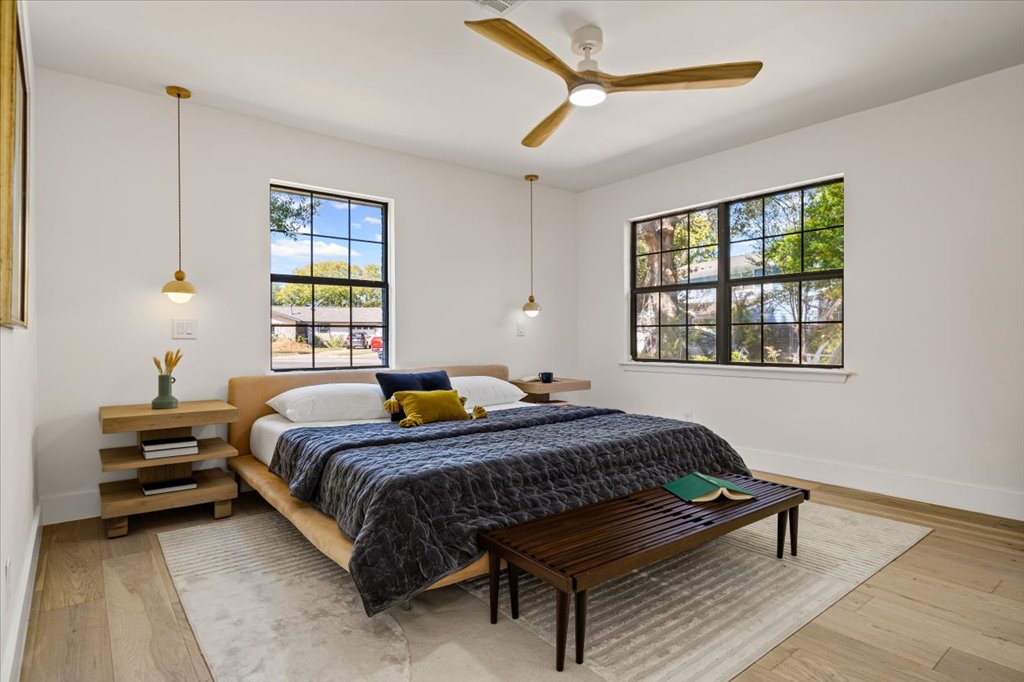 2014 Hardy Circle Austin, TX 78757 - Photo 19 of 34 a bedroom with a bed window and a table